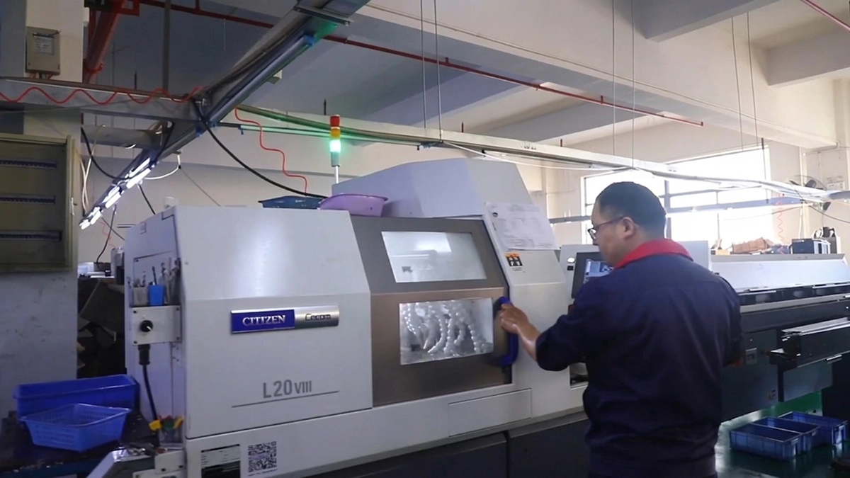 Machine Operator Adjusting the Machine